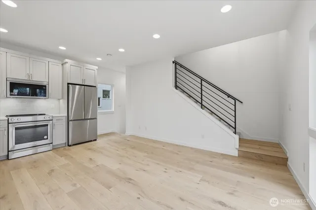 a view of kitchen with microwave and stove