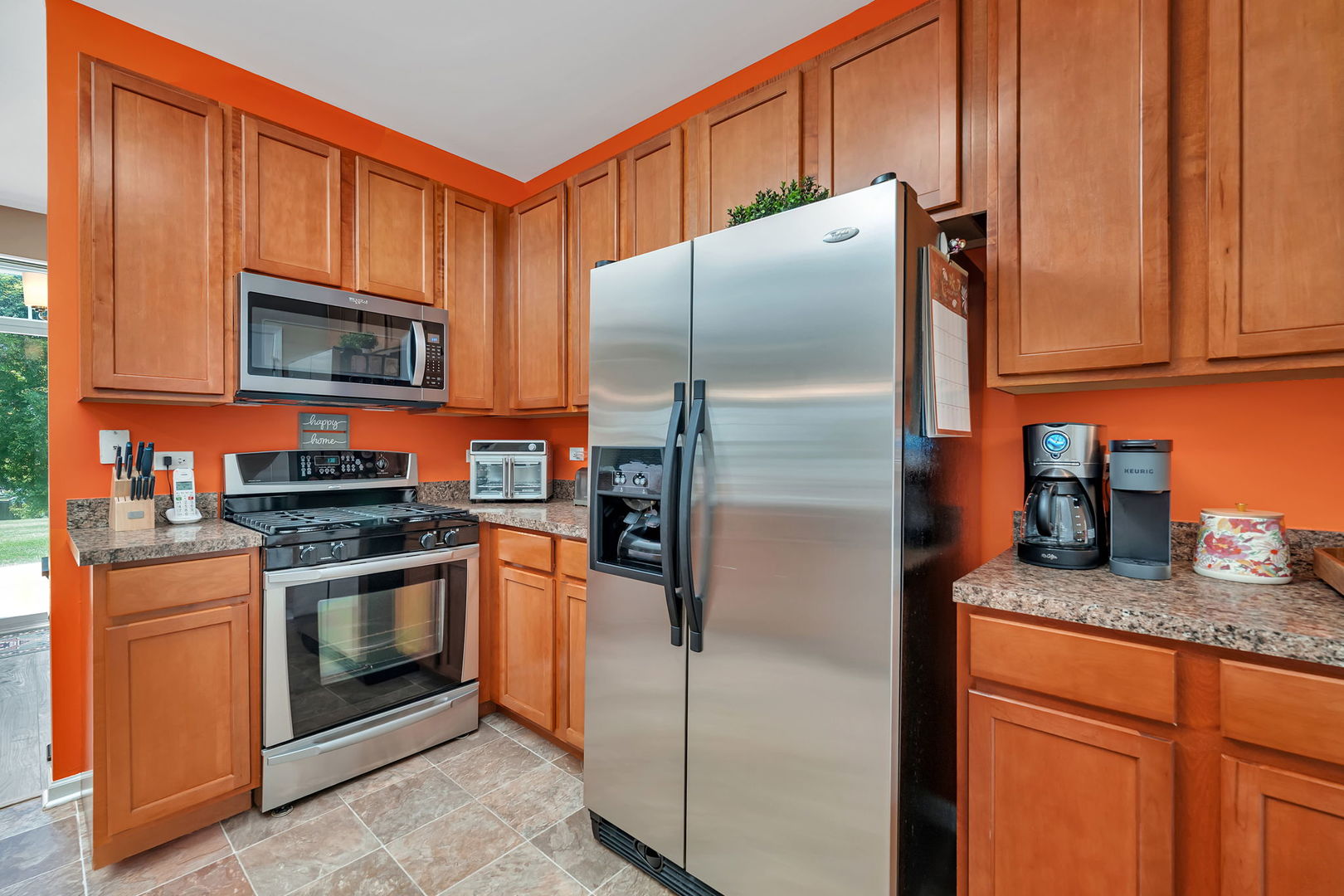 1047 Heron Circle Joliet, IL 60431 - Photo 11 of 25 a kitchen with granite countertop stainless steel appliances and wooden cabinets