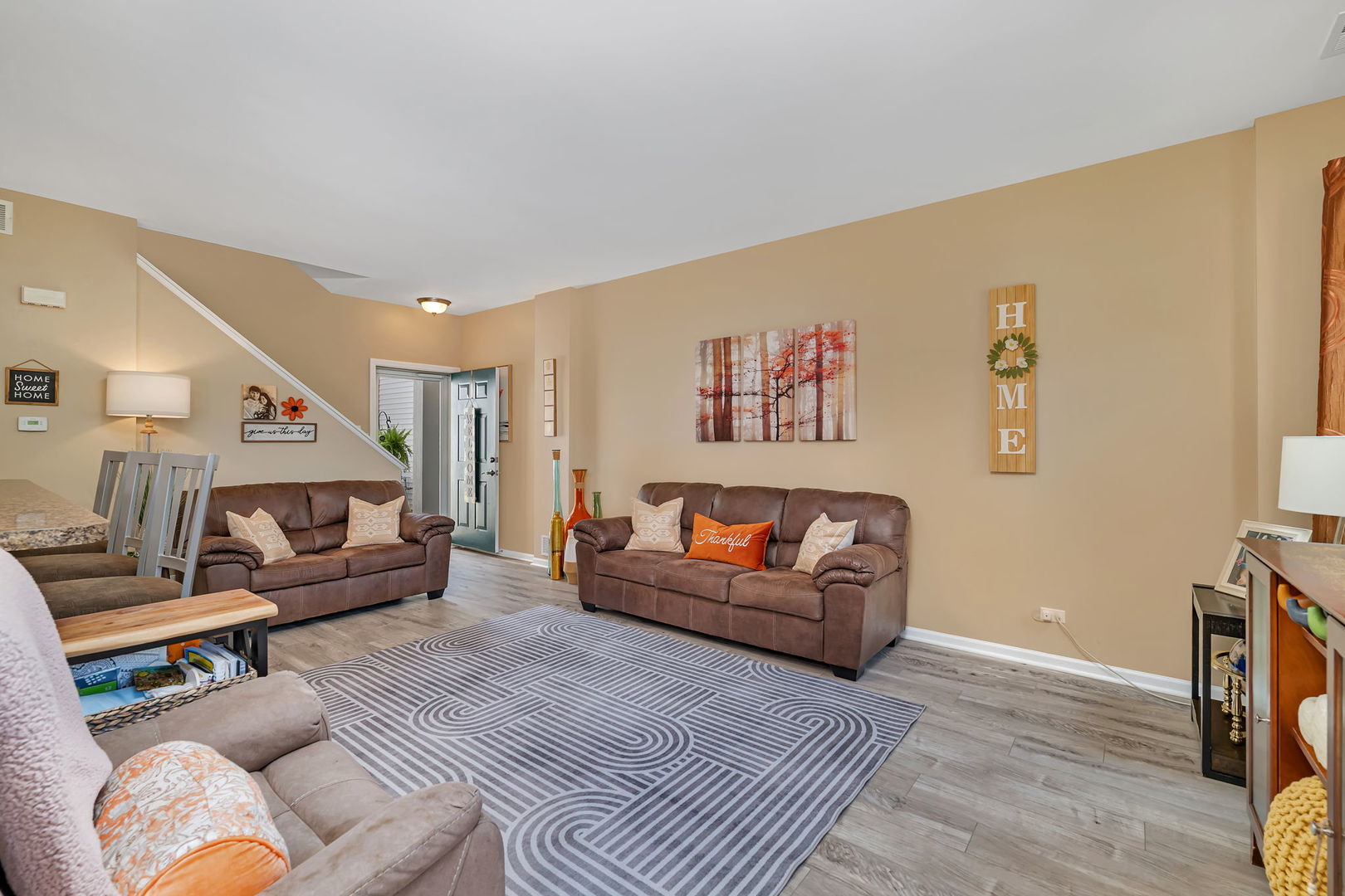 1047 Heron Circle Joliet, IL 60431 - Photo 5 of 25 a living room with furniture and a couch