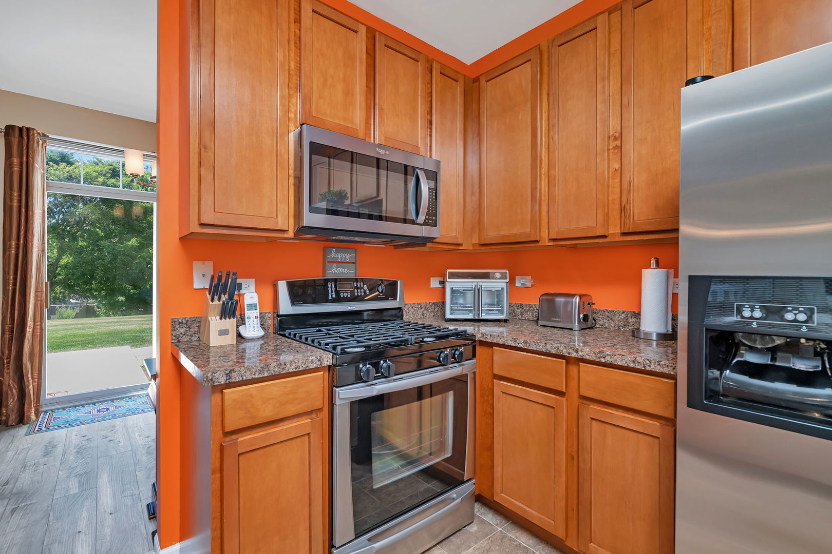 1047 Heron Circle Joliet, IL 60431 - Photo 10 of 25 a kitchen with granite countertop cabinets stainless steel appliances and a counter space