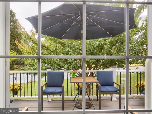 a view of a chairs and table in the patio