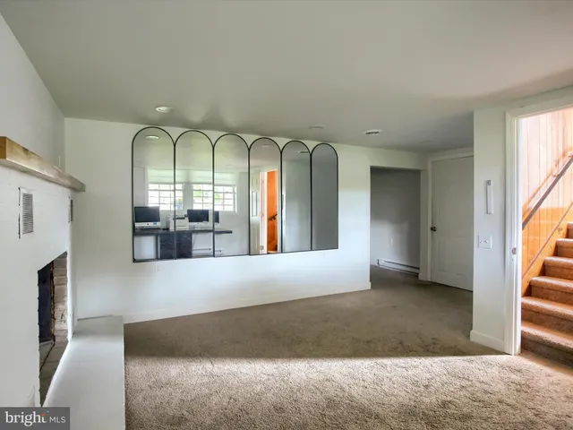 a view of entryway and hall with a window