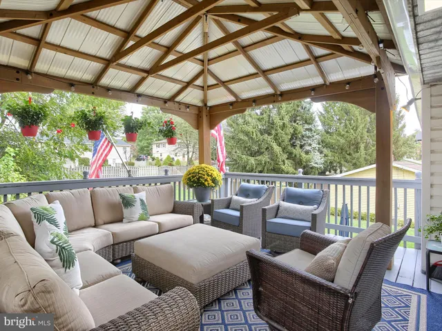 a outdoor living space with furniture and garden view