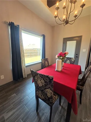 a dining room with furniture and window
