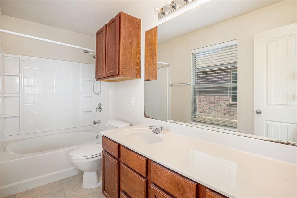 2120 Bliss Road Fort Worth, TX 76177 - Photo 16 of 25 Full bathroom with vanity and bathing tub / shower combination