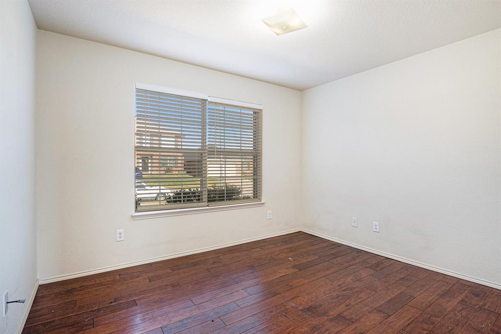2120 Bliss Road Fort Worth, TX 76177 - Photo 17 of 25 Spare room with dark wood-type flooring and baseboards