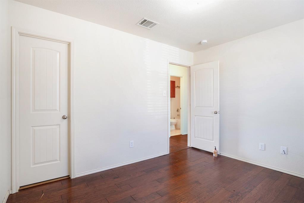 2120 Bliss Road Fort Worth, TX 76177 - Photo 18 of 25 Unfurnished bedroom with dark wood-style flooring and baseboards