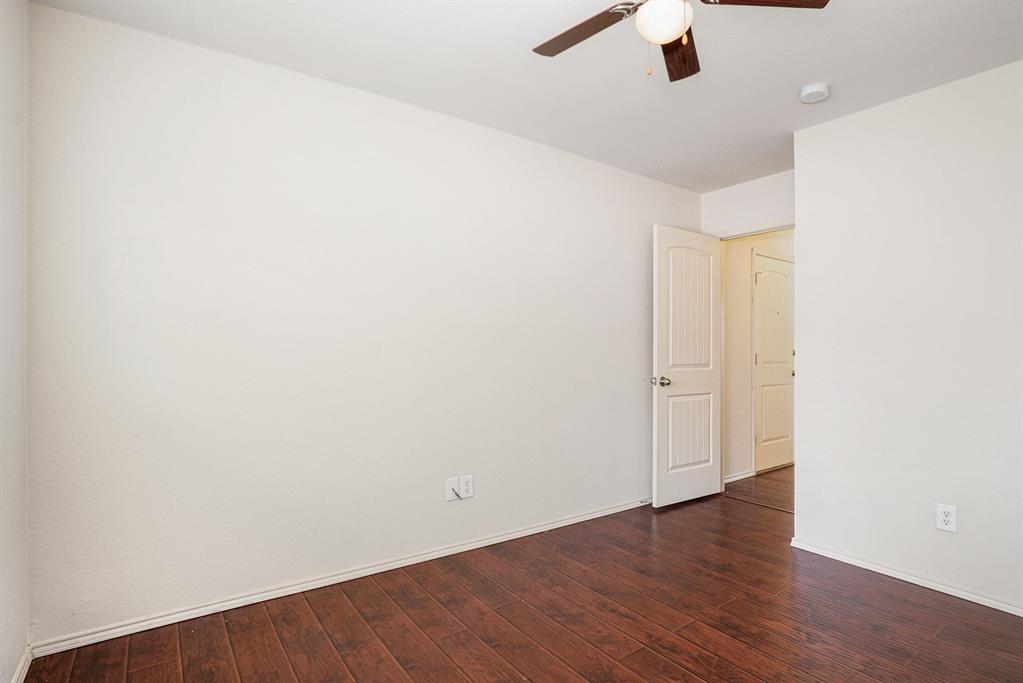 2120 Bliss Road Fort Worth, TX 76177 - Photo 20 of 25 Empty room featuring ceiling fan and dark wood-style flooring