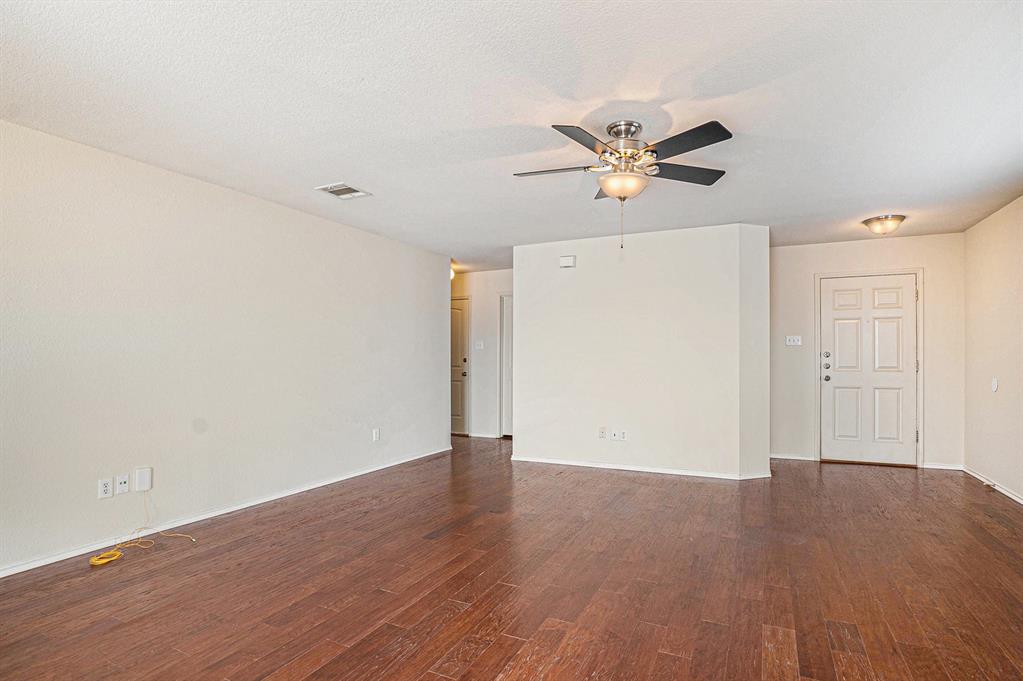 2120 Bliss Road Fort Worth, TX 76177 - Photo 4 of 25 Empty room featuring a ceiling fan and dark wood finished floors