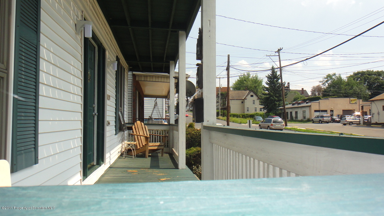525 Green Ridge Street Scranton, PA 18509 - Photo 4 of 6 a view of a living room couch and floor to ceiling window