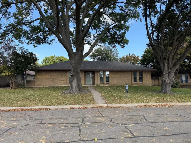 a house with trees in the background