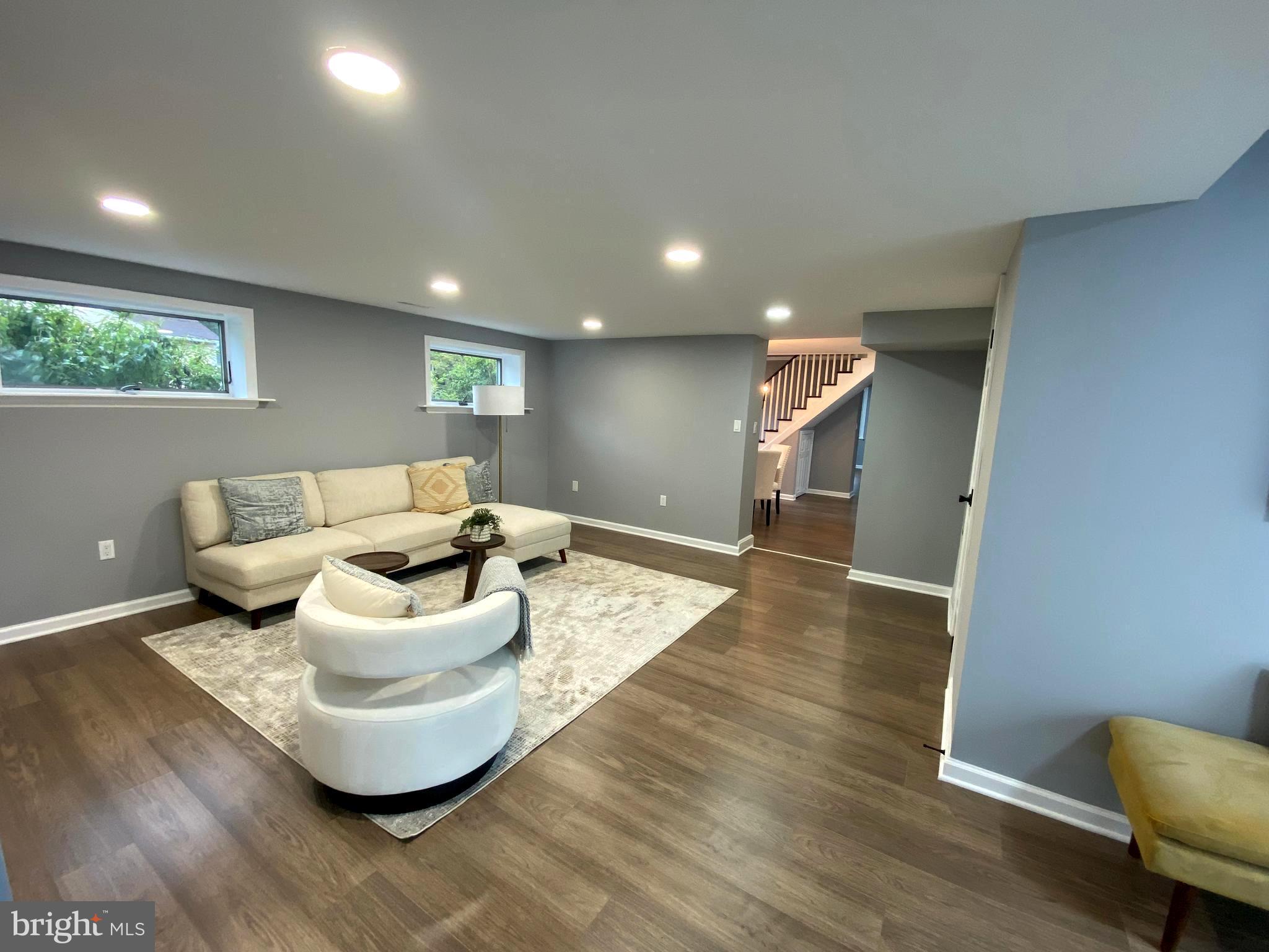 15 East 8th Avenue Pine Hill, NJ 08021 - Photo 13 of 32 a living room with furniture and a wooden floor