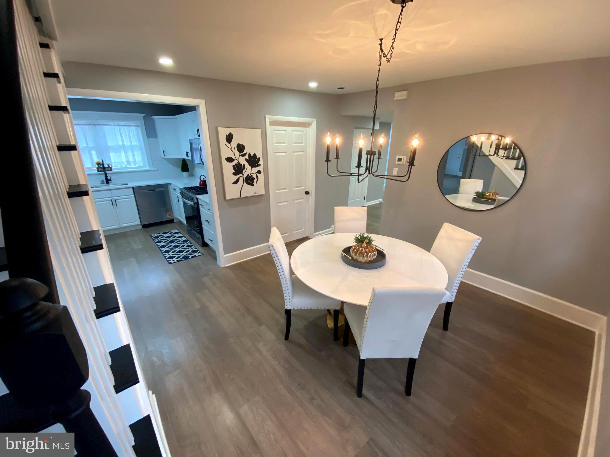 15 East 8th Avenue Pine Hill, NJ 08021 - Photo 19 of 32 a view of a dining room with furniture and wooden floor