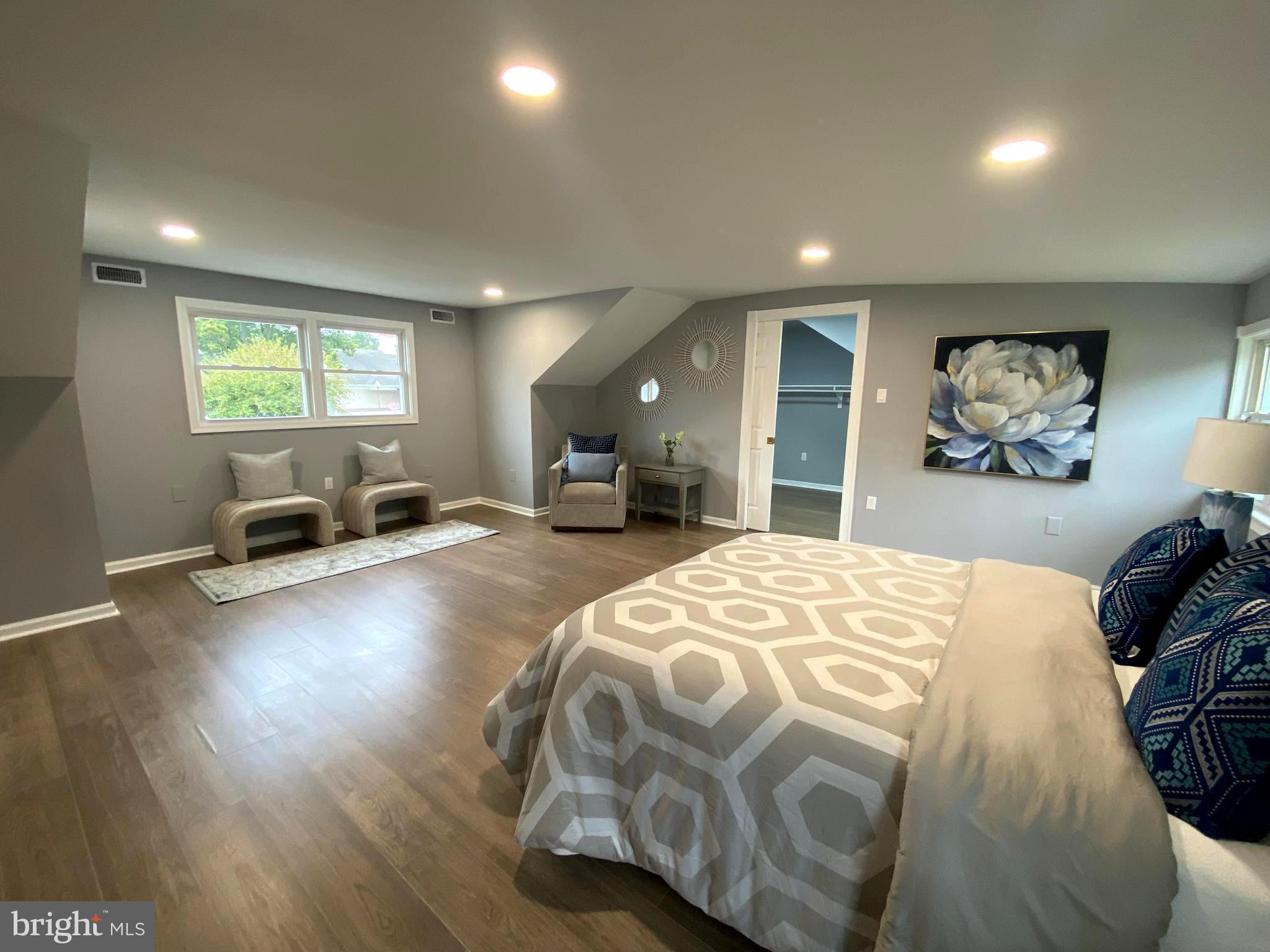15 East 8th Avenue Pine Hill, NJ 08021 - Photo 26 of 32 a bed room with a bed and a large white kitchen
