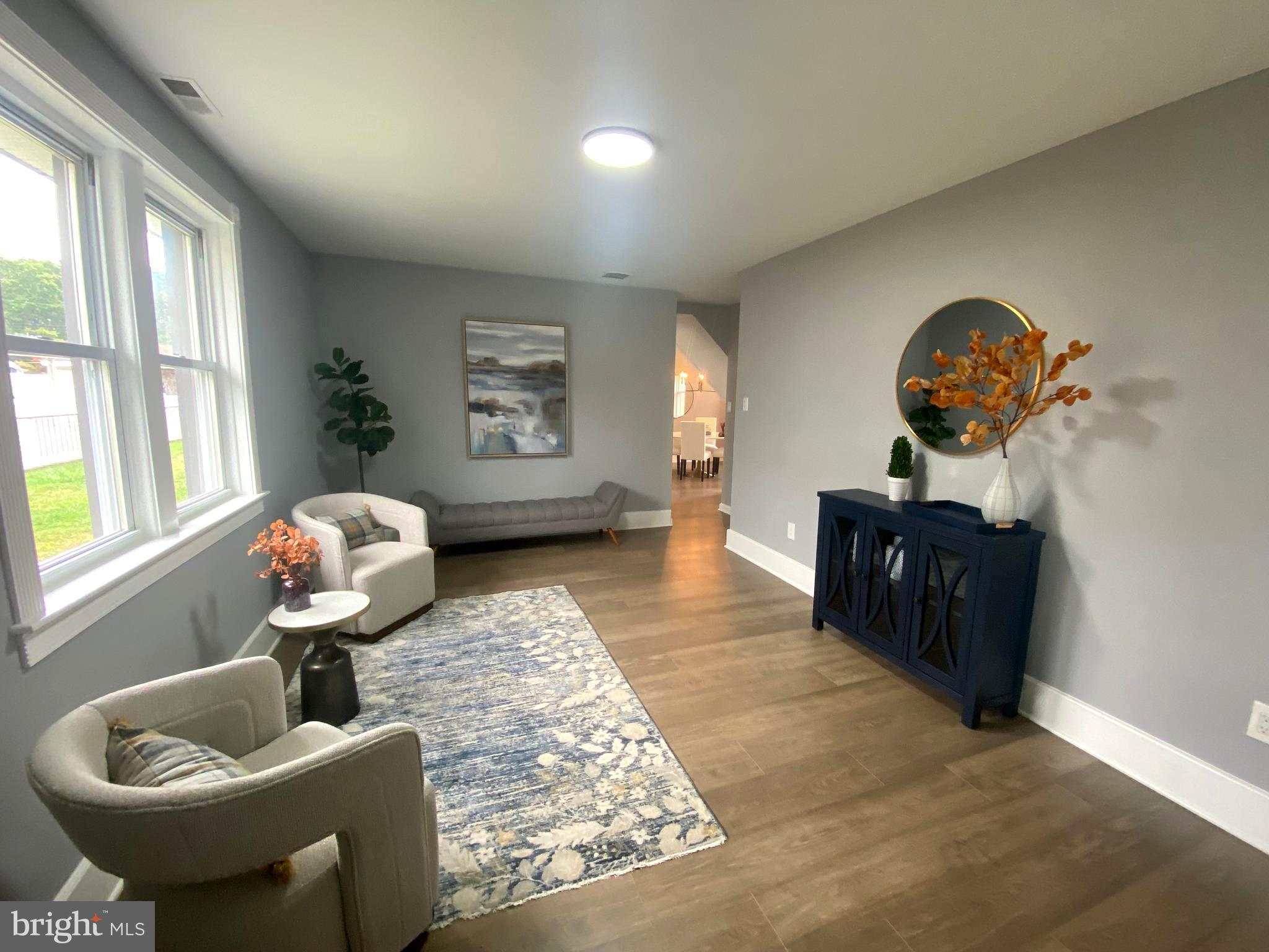 15 East 8th Avenue Pine Hill, NJ 08021 - Photo 6 of 32 a living room with furniture and a potted plant