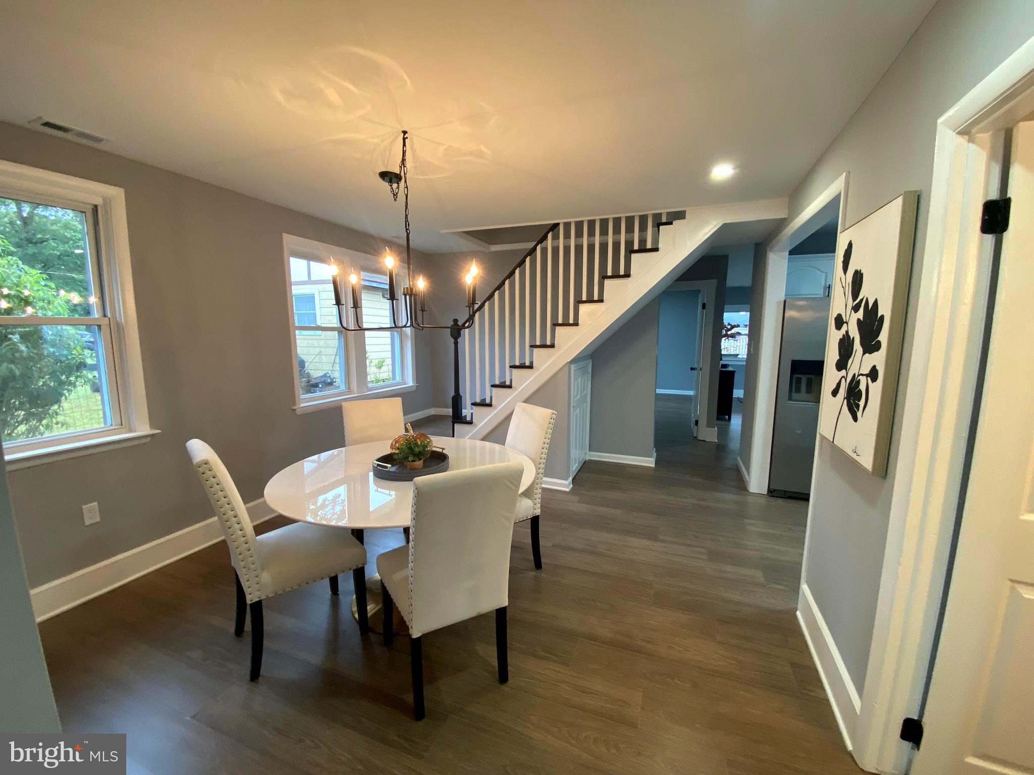 15 East 8th Avenue Pine Hill, NJ 08021 - Photo 10 of 32 a dining room with furniture entryway and wooden floor