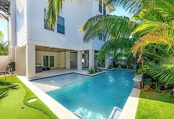a view of swimming pool with a yard