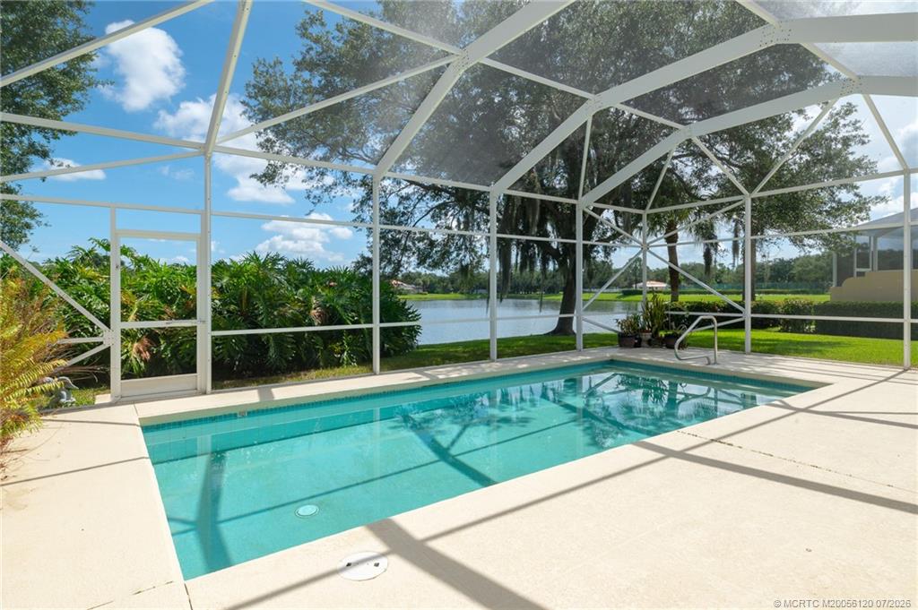 1313 Southwest Balmoral Trace Stuart, FL 34997 - Photo 50 of 70 Newly Screened pool enclosure and premium lake view