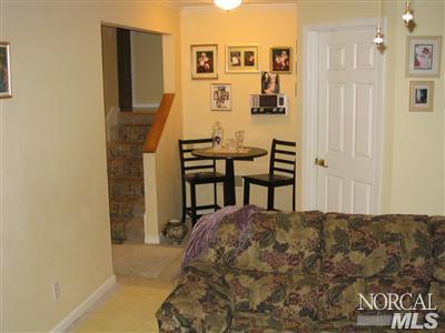 3195 Wagner Place Santa Rosa, CA 95404 - Photo 8 of 9 a bedroom with a bed and a table in it