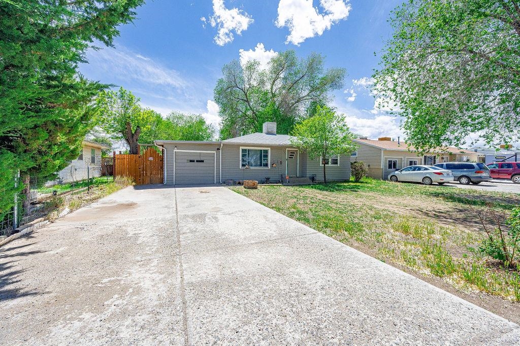 2893 Seely Road Grand Junction, CO 81503 - Photo 2 of 28 a house view with a sitting space and garden