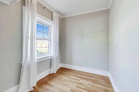 a view of an empty room and window