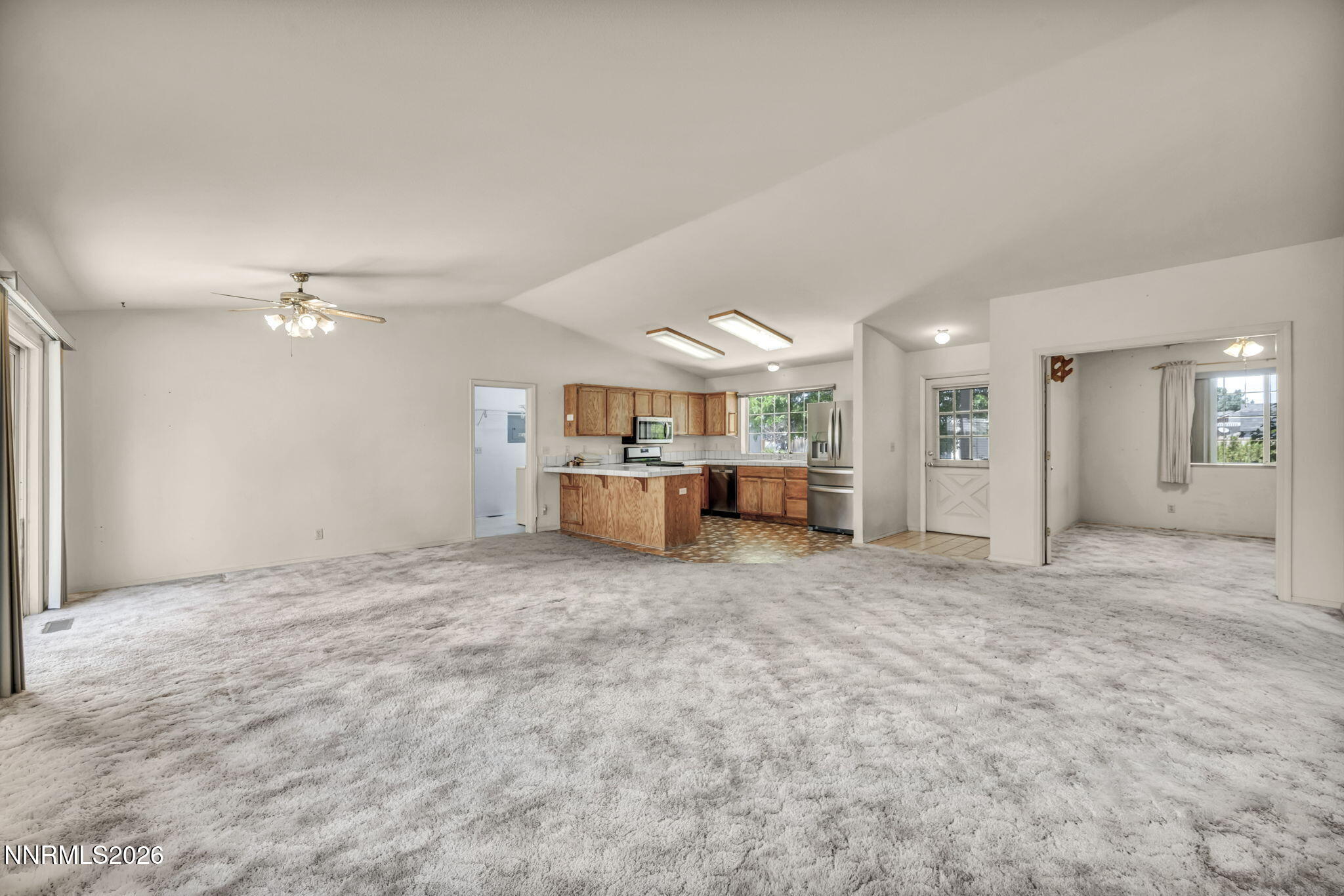 692 Lassen Way Gardnerville, NV 89460 - Photo 8 of 34 a view of a livingroom with furniture and windows
