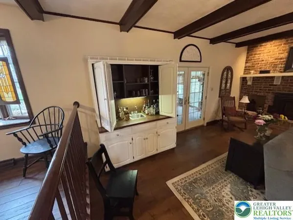 a view of living room with furniture and flat screen tv