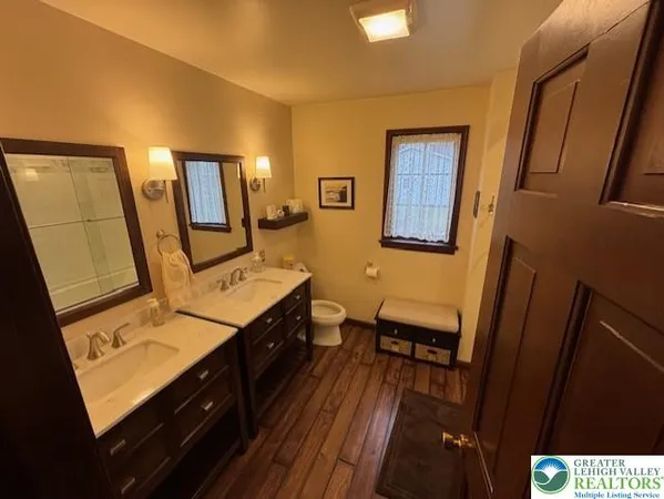 a view of a hallway with furniture
