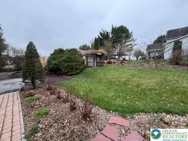 a view of a garden with houses