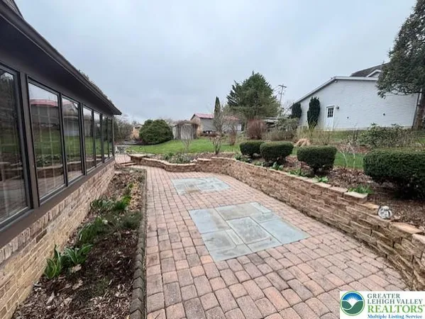 a view of a pathway with a backyard