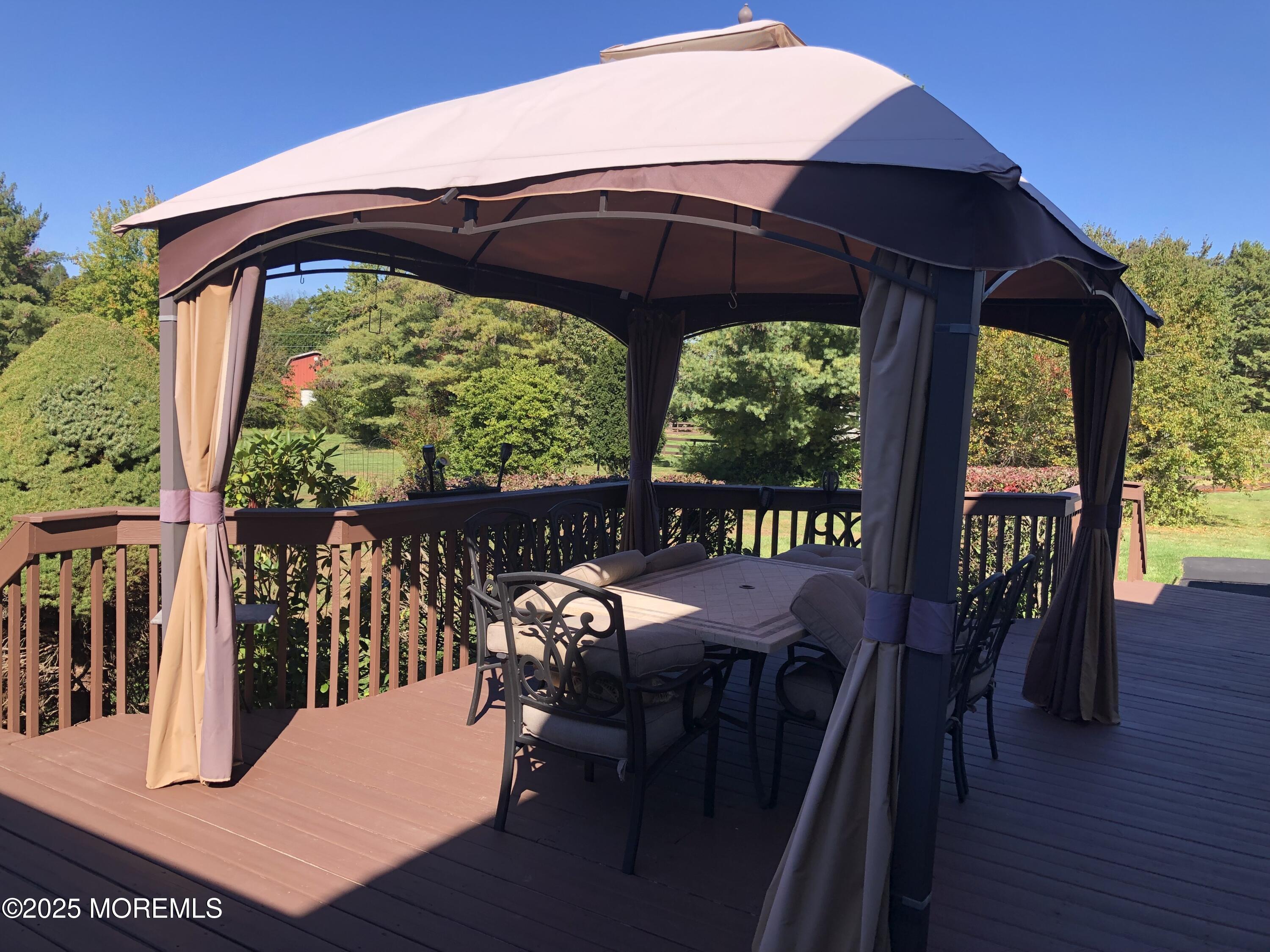 10 Saddlebrook Road Millstone Township, NJ 08535 - Photo 11 of 86 a view of a balcony with furniture and wooden floor