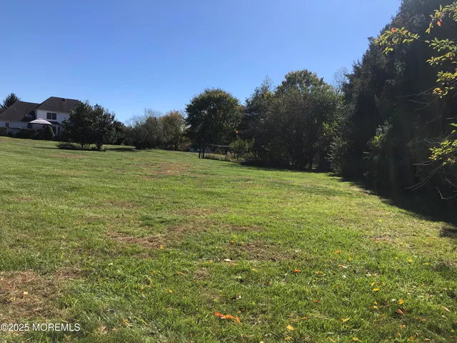 a view of a dining room with furniture and window