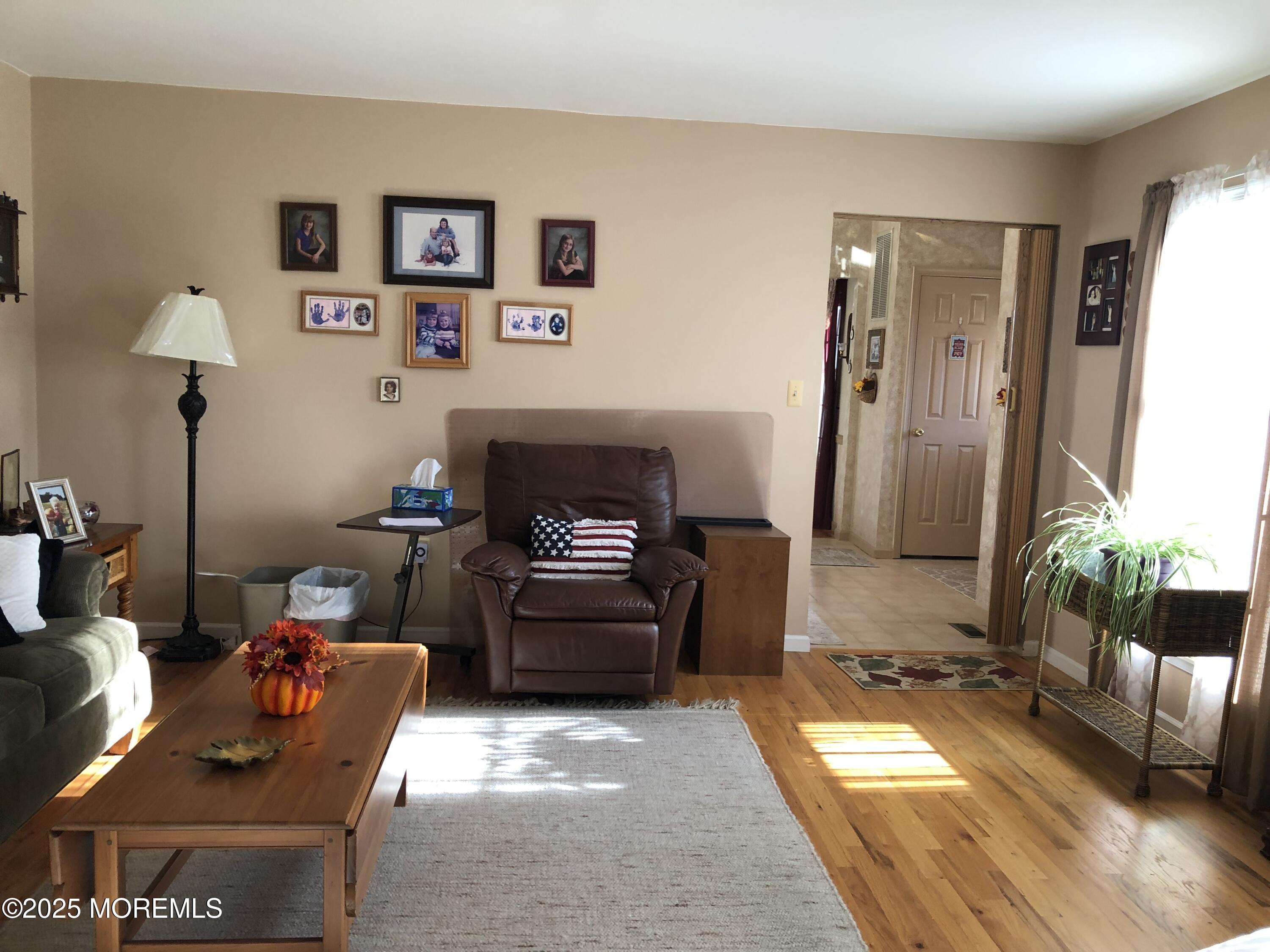 10 Saddlebrook Road Millstone Township, NJ 08535 - Photo 24 of 86 a living room with furniture and a fireplace