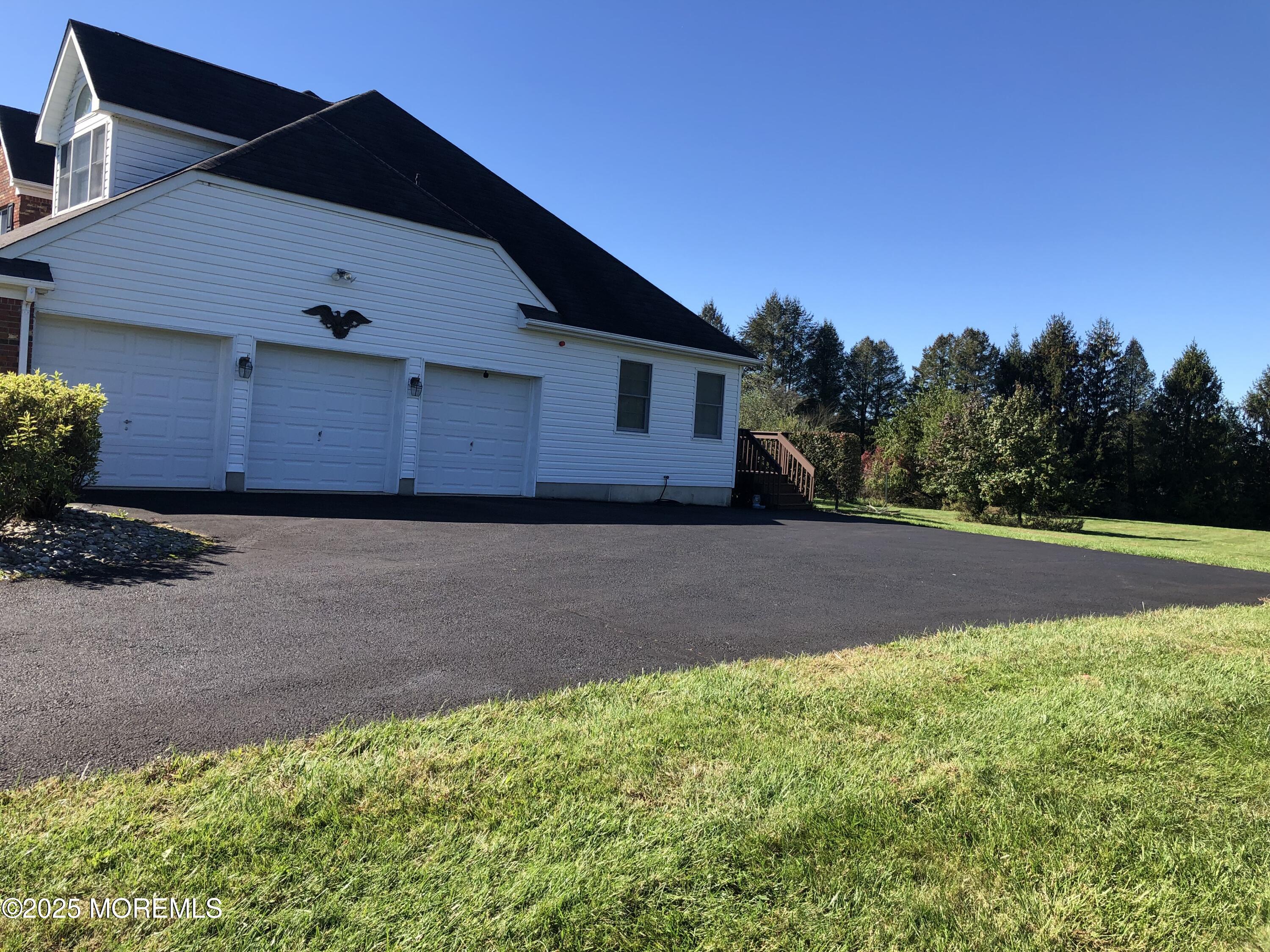 10 Saddlebrook Road Millstone Township, NJ 08535 - Photo 3 of 86 a front view of a house with a yard and garage