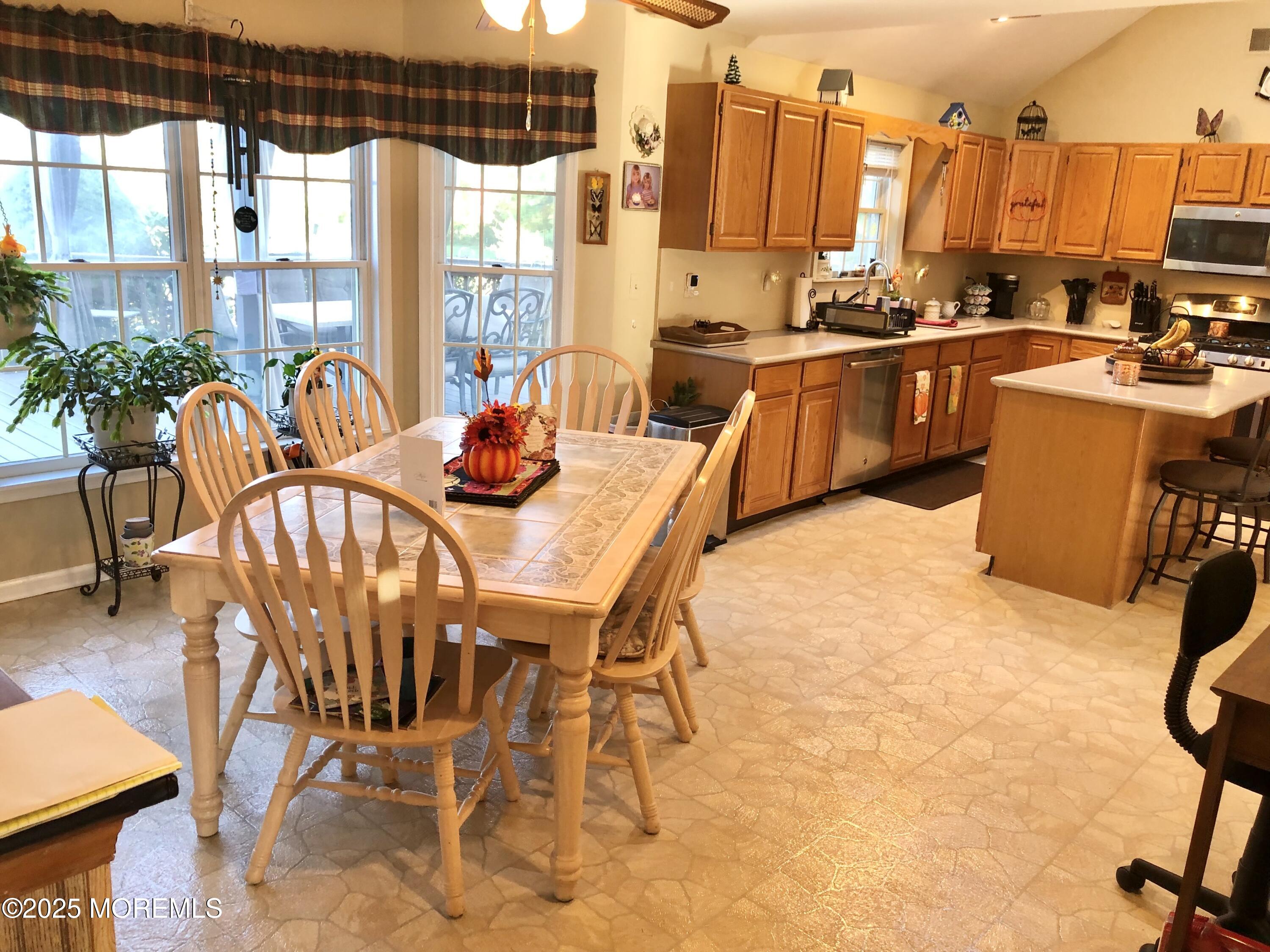 10 Saddlebrook Road Millstone Township, NJ 08535 - Photo 36 of 86 a view of a dining room with furniture a chandelier and wooden floor