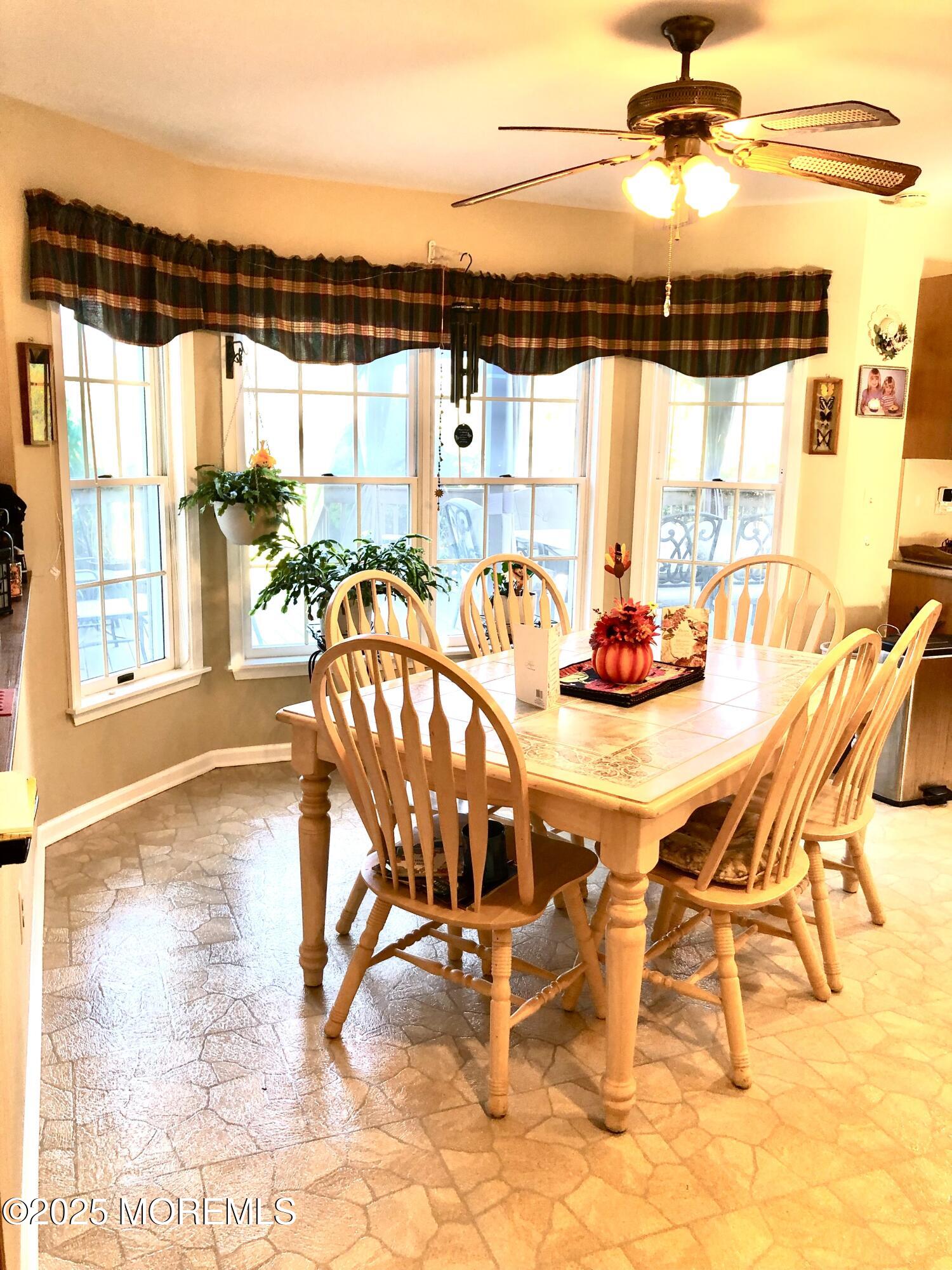 10 Saddlebrook Road Millstone Township, NJ 08535 - Photo 39 of 86 a dining room with furniture and wooden floor