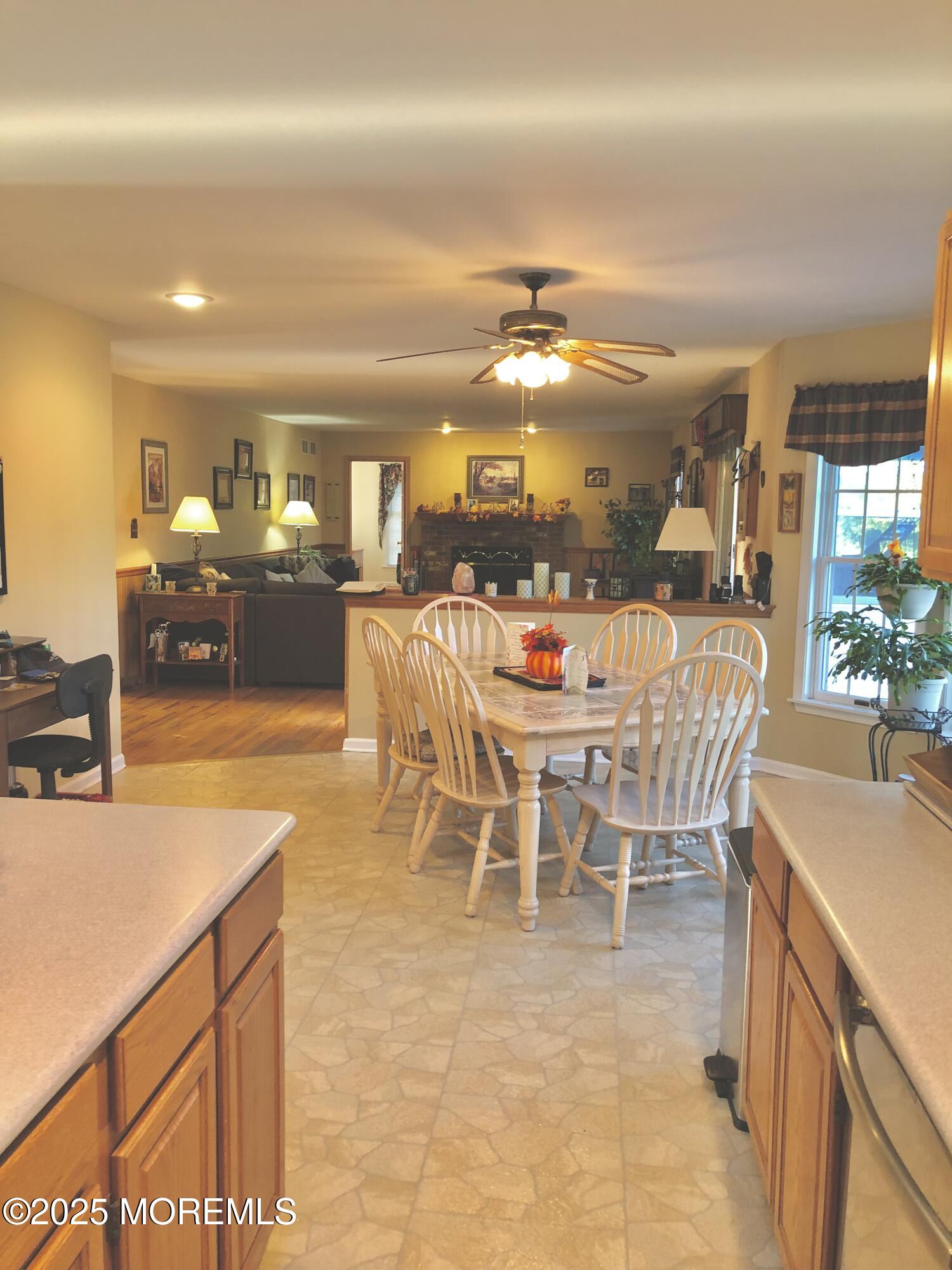 10 Saddlebrook Road Millstone Township, NJ 08535 - Photo 40 of 86 a dining table with chairs and chandelier