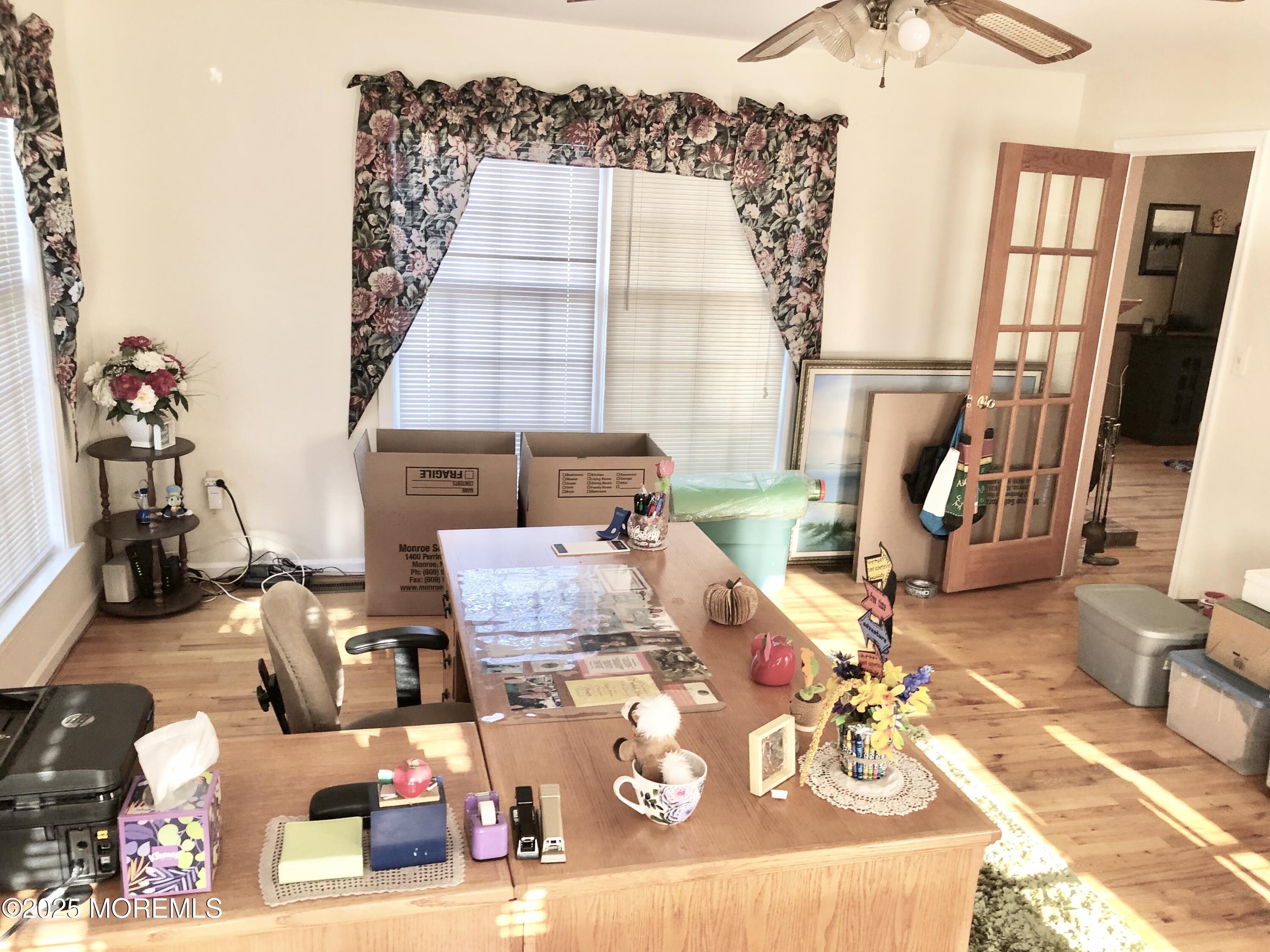 10 Saddlebrook Road Millstone Township, NJ 08535 - Photo 47 of 86 a living room with furniture and a flat screen tv