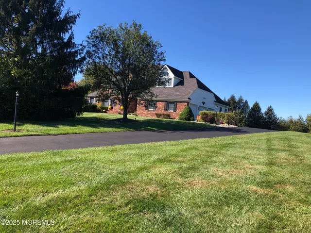 a view of a house with a big yard