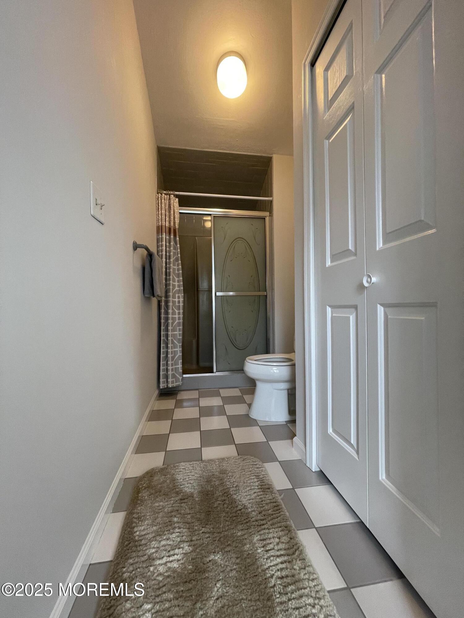 10 Saddlebrook Road Millstone Township, NJ 08535 - Photo 76 of 86 a view of a hallway with wooden floor and a living room