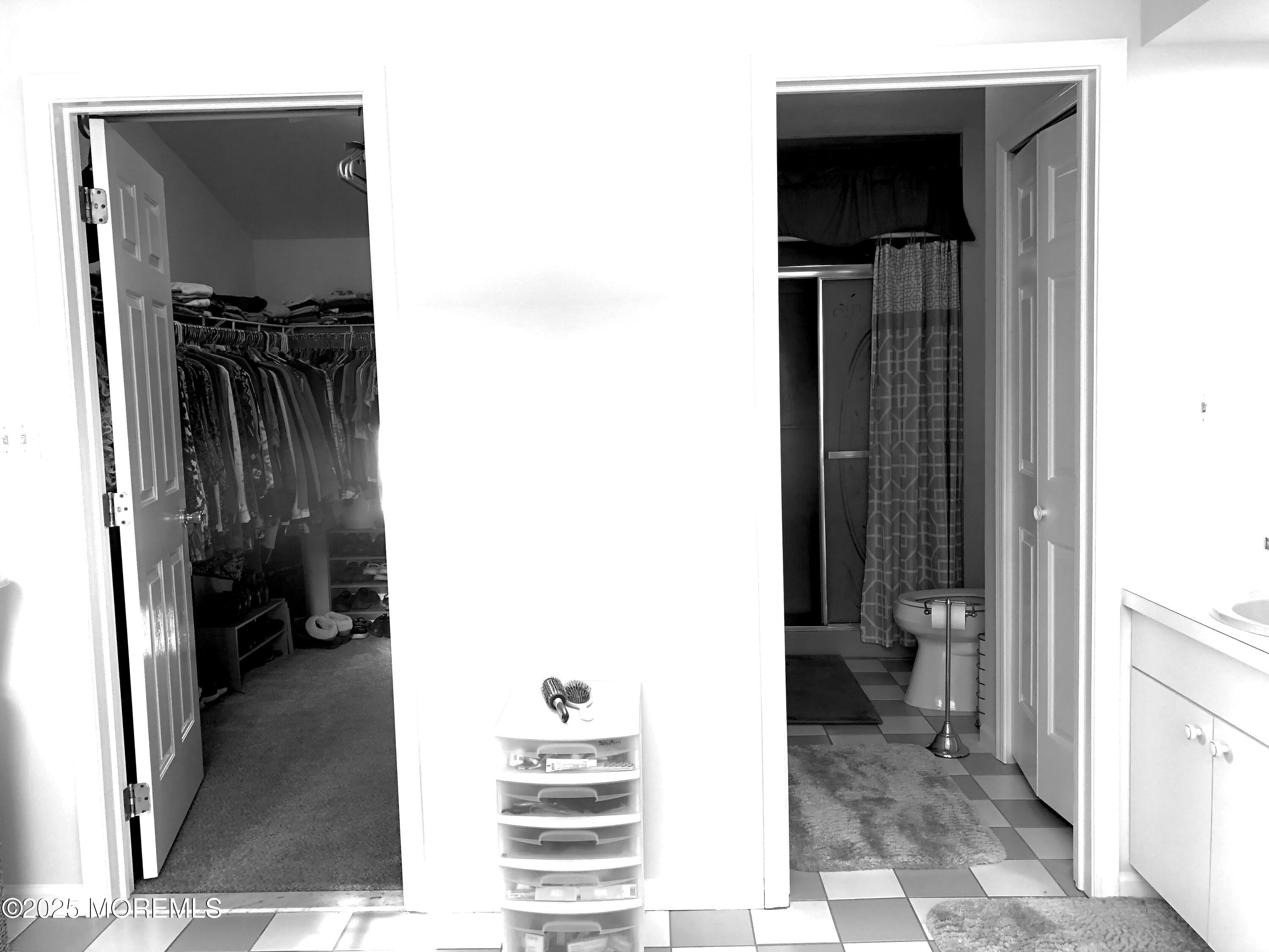 10 Saddlebrook Road Millstone Township, NJ 08535 - Photo 78 of 86 a view of a walk in closet and bedroom