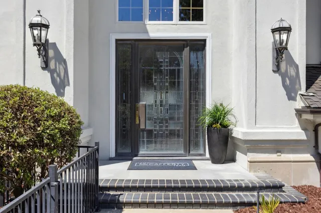 a view of a house with backyard sitting area and garden