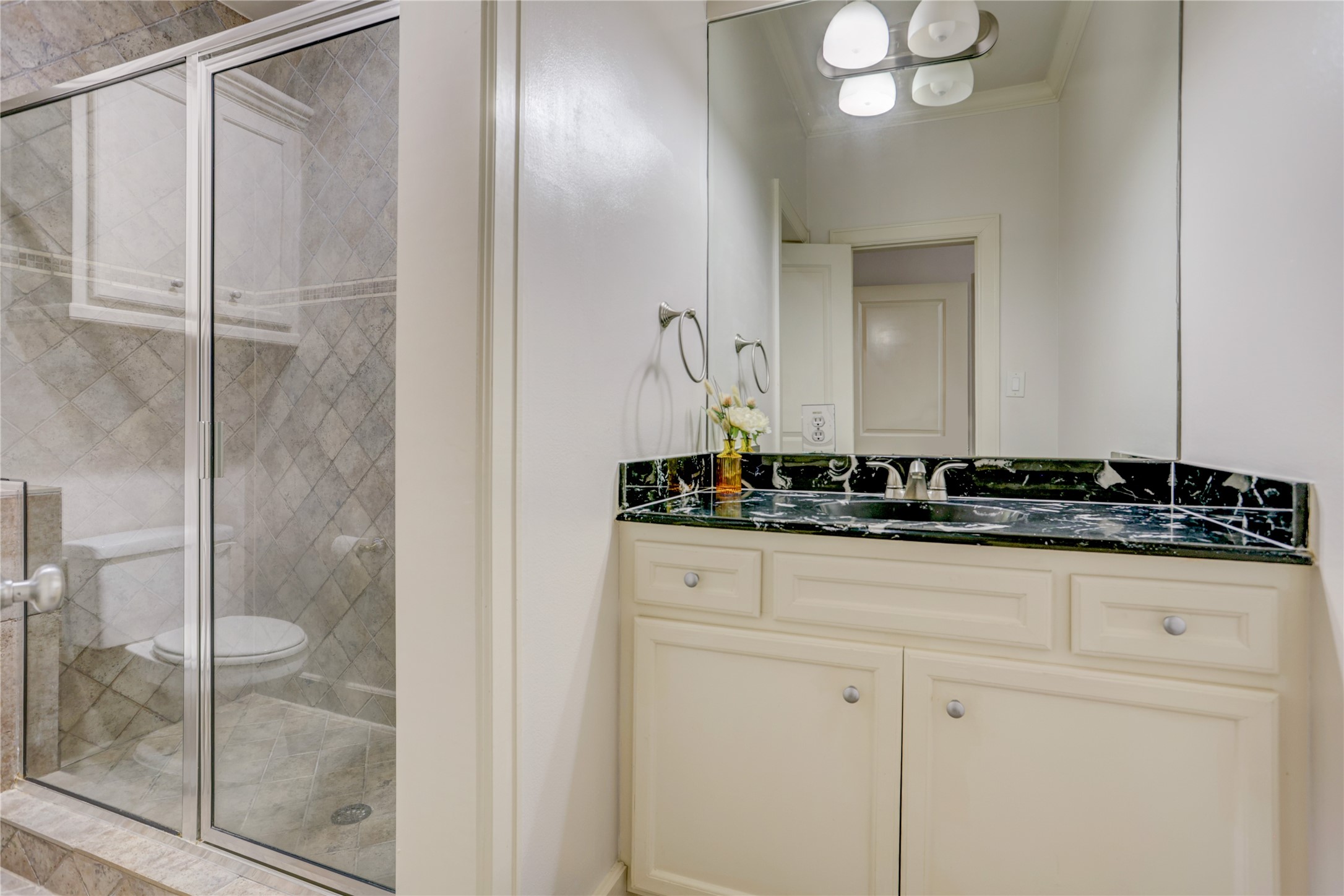 4262 Childress Street, Unit B Houston, TX 77005 - Photo 6 of 22 a bathroom with a sink and a mirror