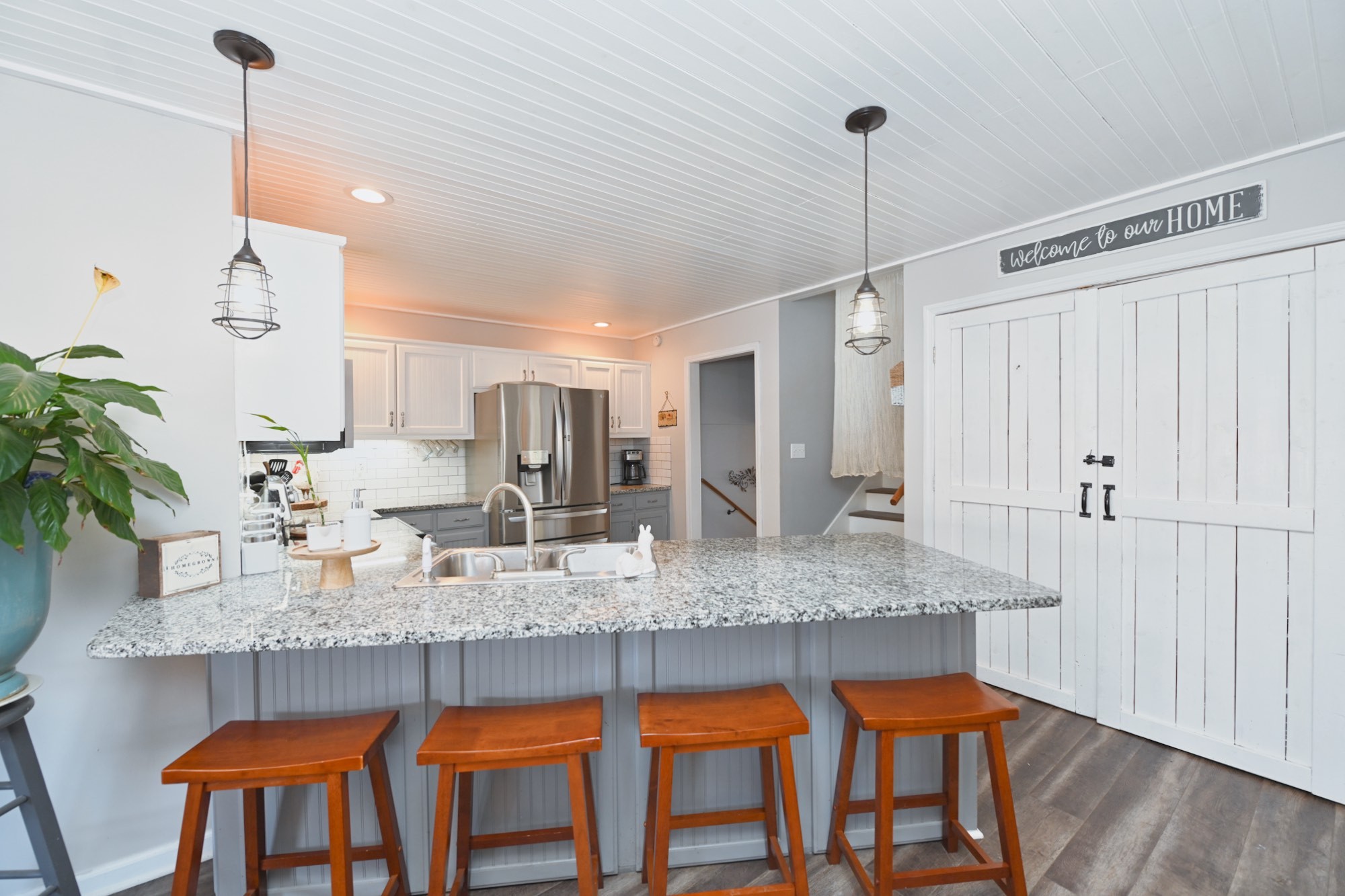 3376 Maxie Jones Road Springfield, TN 37172 - Photo 15 of 48 a kitchen with granite countertop a table chairs stove and granite counter tops