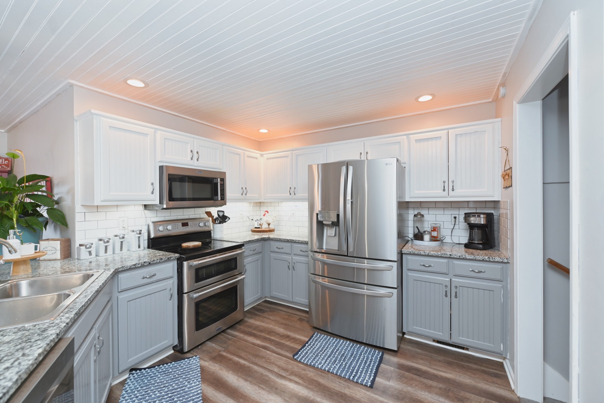 3376 Maxie Jones Road Springfield, TN 37172 - Photo 16 of 48 a kitchen with white cabinets and stainless steel appliances