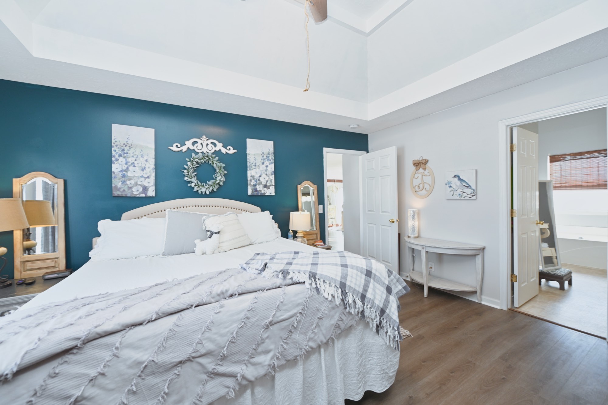 3376 Maxie Jones Road Springfield, TN 37172 - Photo 20 of 48 a bedroom with a large bed and a wooden floor