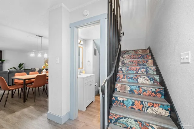 a bedroom with bed and a chandelier