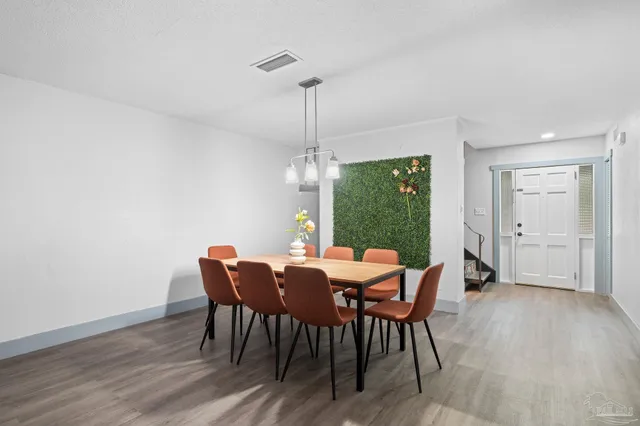 a kitchen with a sink a stove and cabinets