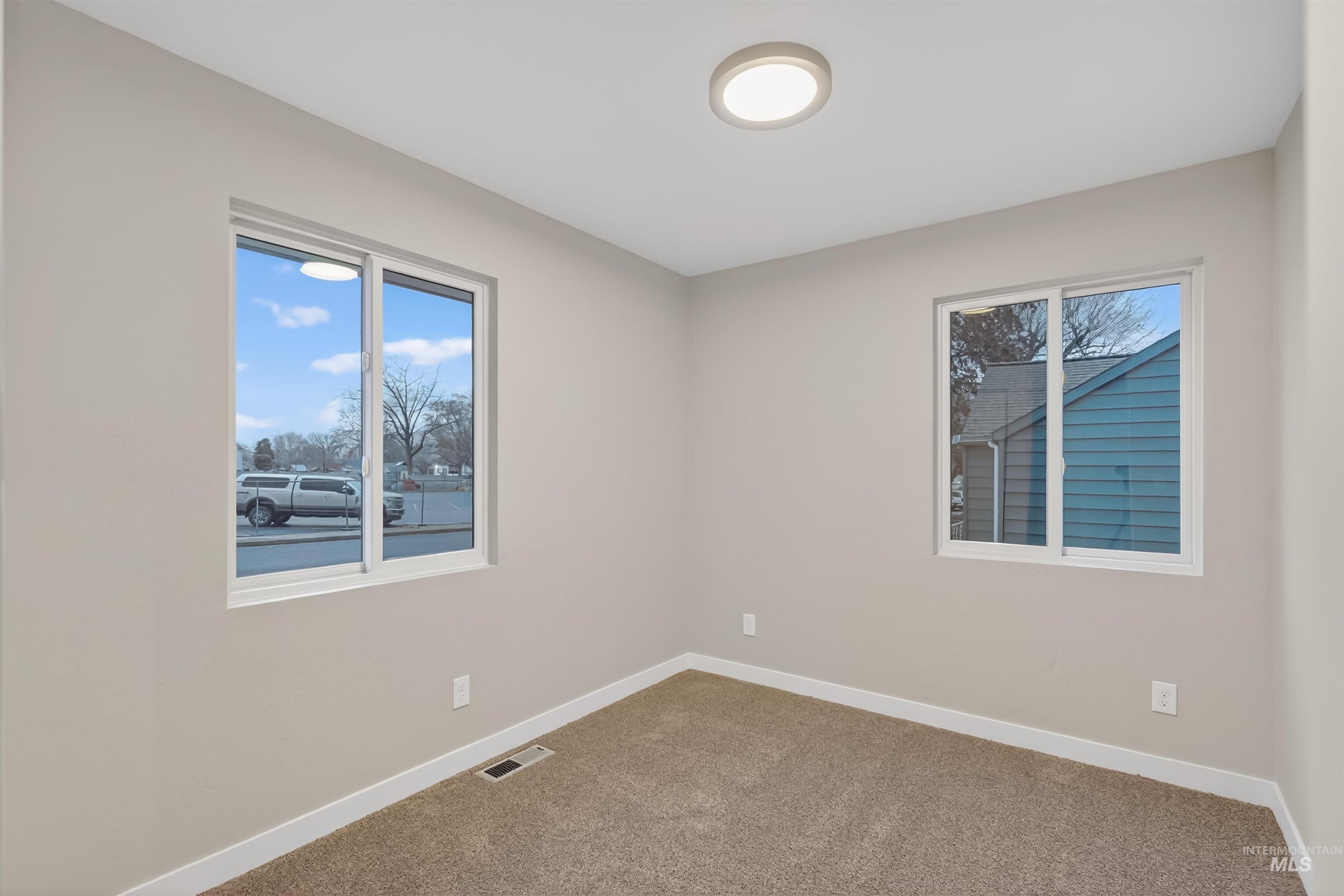 929 10th Street Clarkston, WA 99403 - Photo 16 of 43 Unfurnished room featuring baseboards and carpet