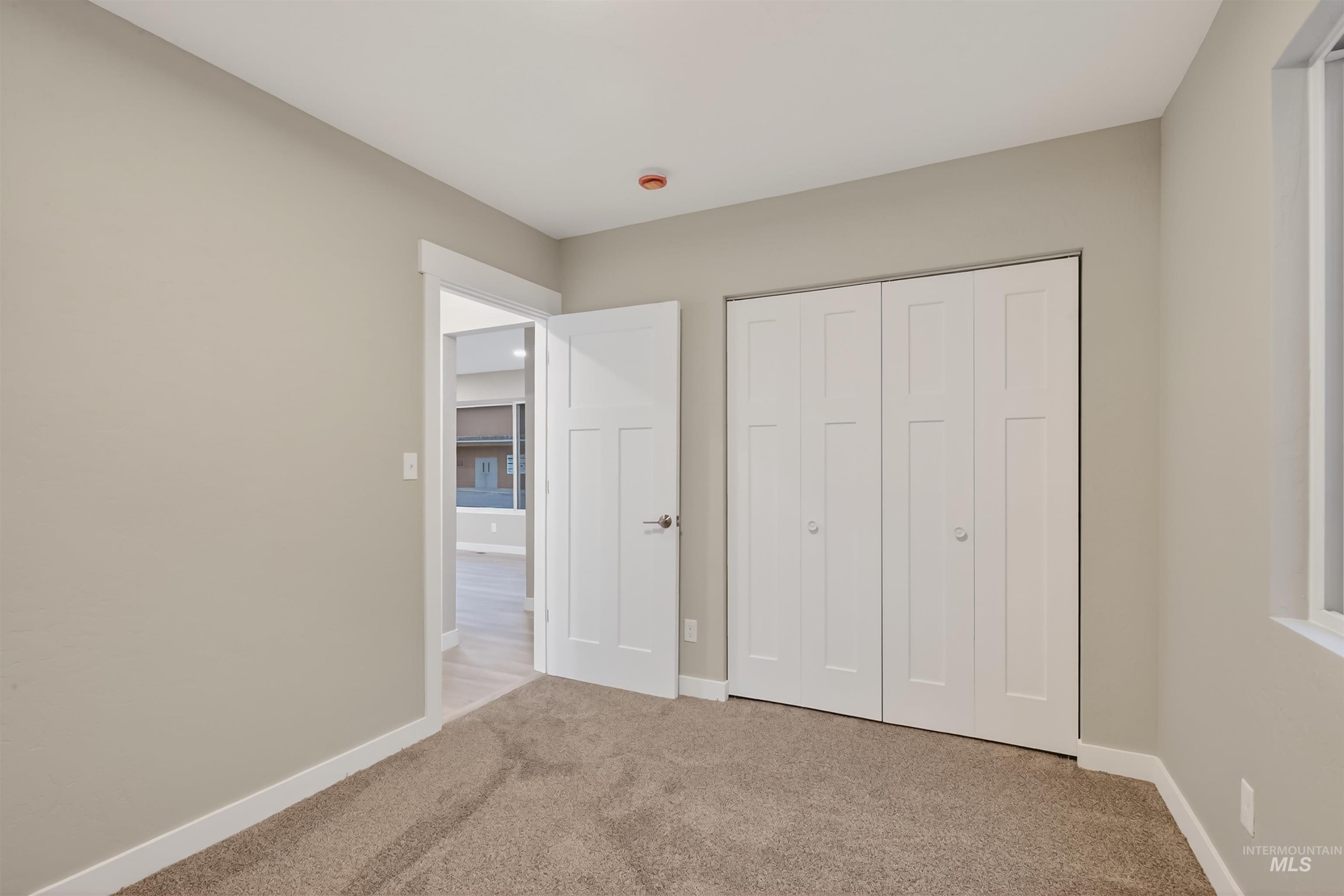 929 10th Street Clarkston, WA 99403 - Photo 20 of 43 Unfurnished bedroom with carpet flooring and a closet